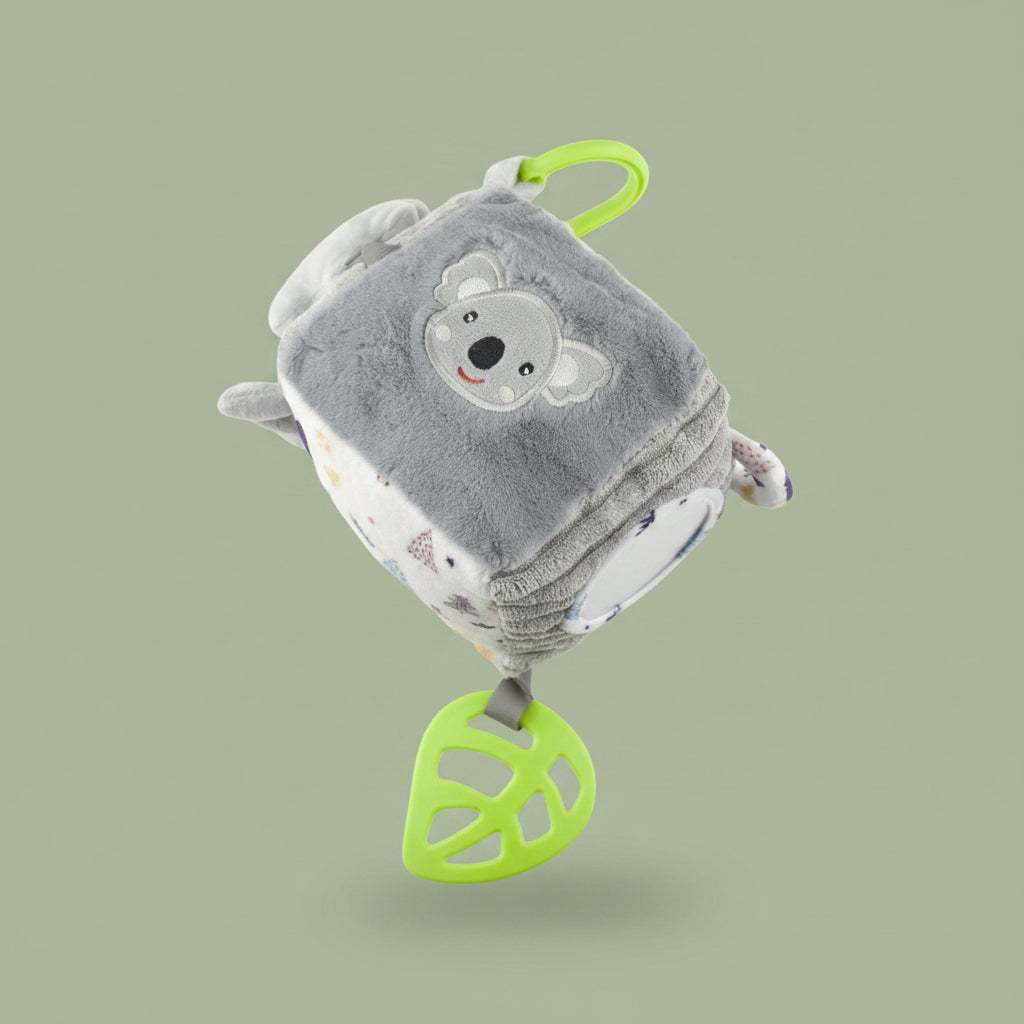 Plush toy with a bear design and green accents on a olive-green background