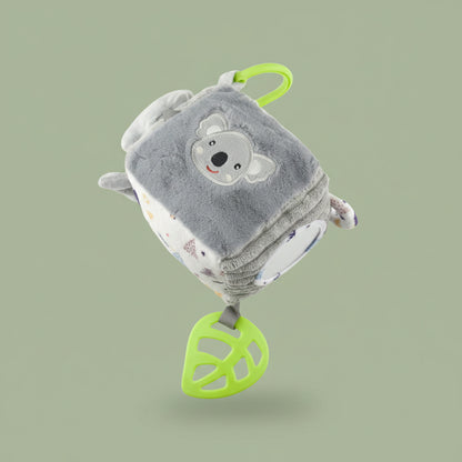 Plush toy with a bear design and green accents on a olive-green background